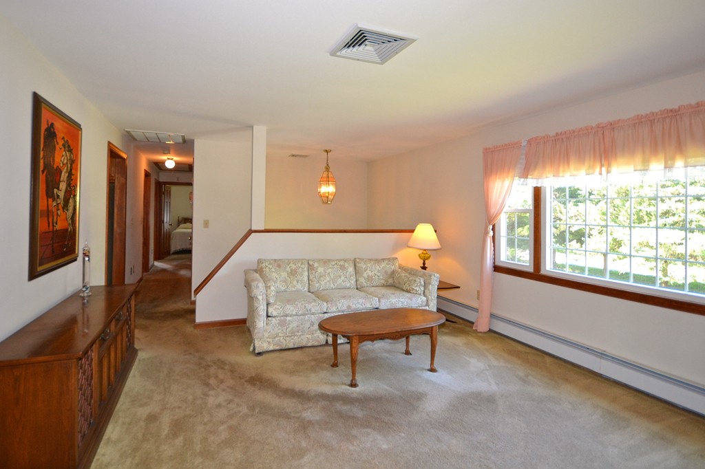 722 Snipatuit Road Rochester, MA 02770 - Photo 5 of 15 a living room with furniture and a window