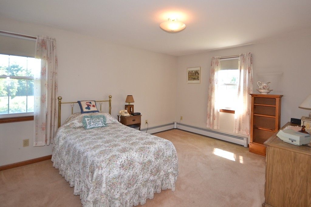 722 Snipatuit Road Rochester, MA 02770 - Photo 8 of 15 a bedroom with a bed and a window