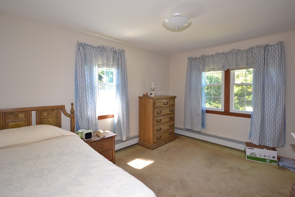 722 Snipatuit Road Rochester, MA 02770 - Photo 9 of 15 a bedroom with a bed and window