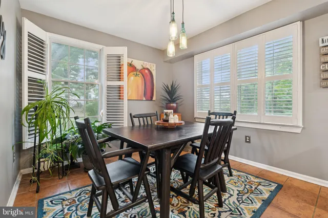 a bathroom with a toilet a sink and a mirror