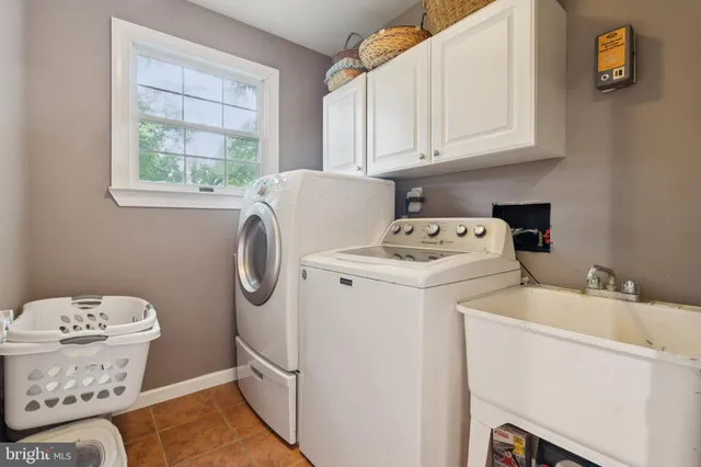 a bathroom with a granite countertop sink a toilet and a mirror