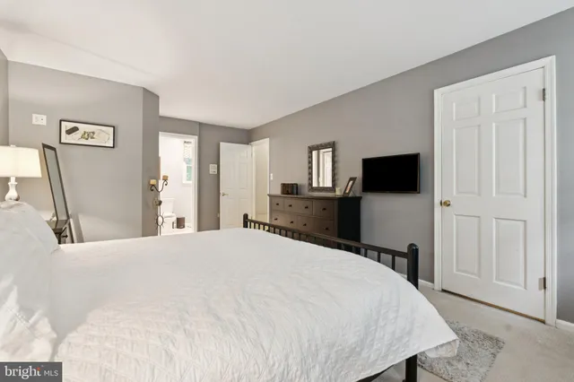 a white toilet sitting next to a bath tub