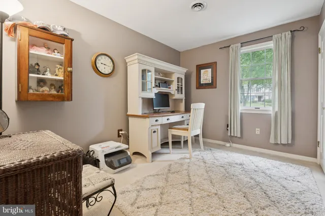 a living room with lots of furniture and gym equipment
