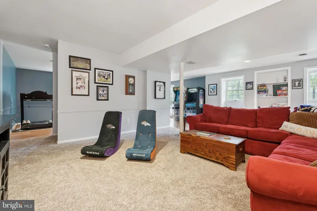 a view of a yard in front of a house with large tree