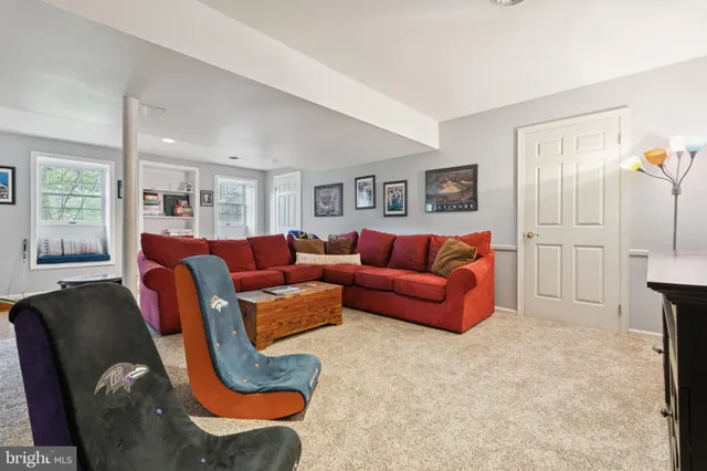 a front view of house with yard and trees