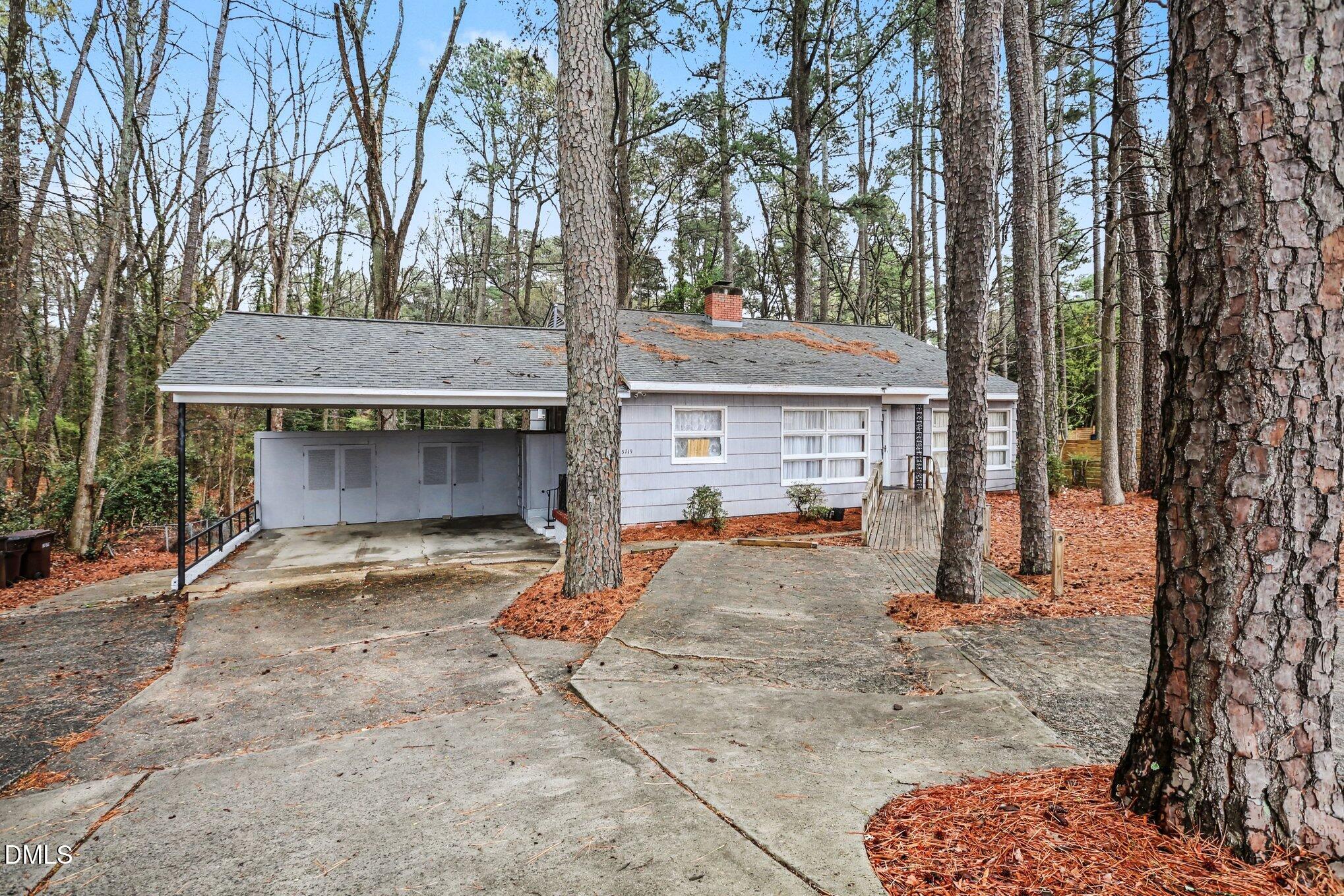 3719 Old Chapel Hill Road Durham, NC 27707 - Photo 2 of 33 a view of a house with backyard and trees