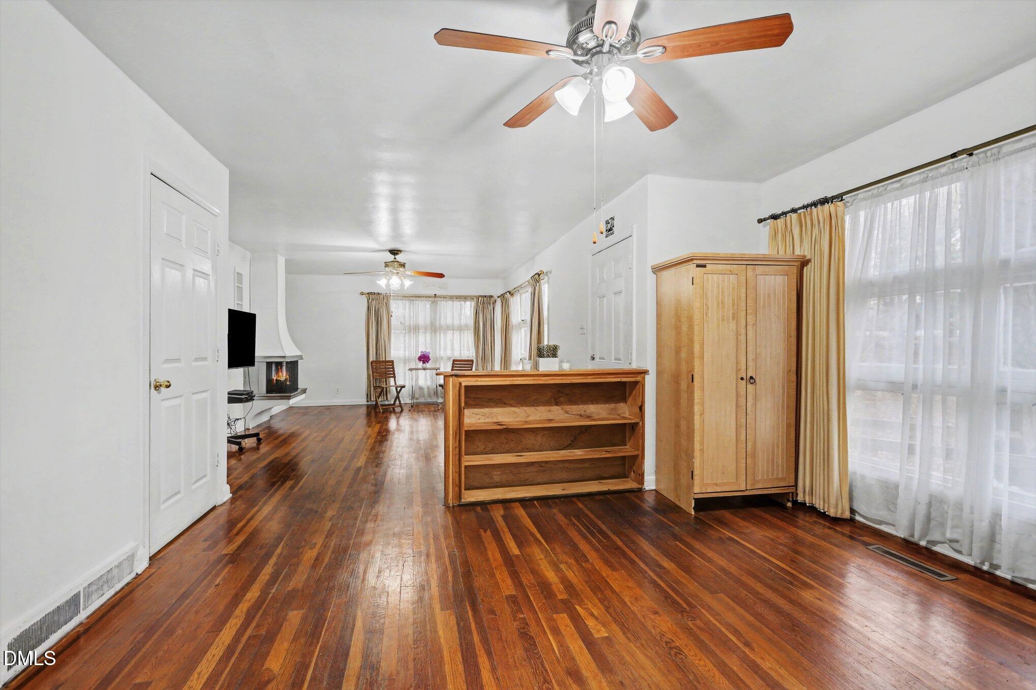 3719 Old Chapel Hill Road Durham, NC 27707 - Photo 4 of 33 wooden floor and windows in a room