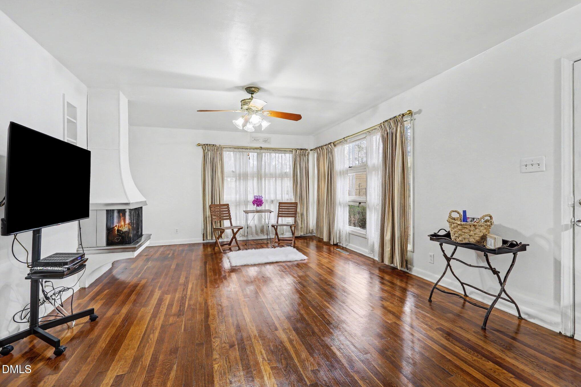 3719 Old Chapel Hill Road Durham, NC 27707 - Photo 6 of 33 a living room with furniture and a flat screen tv