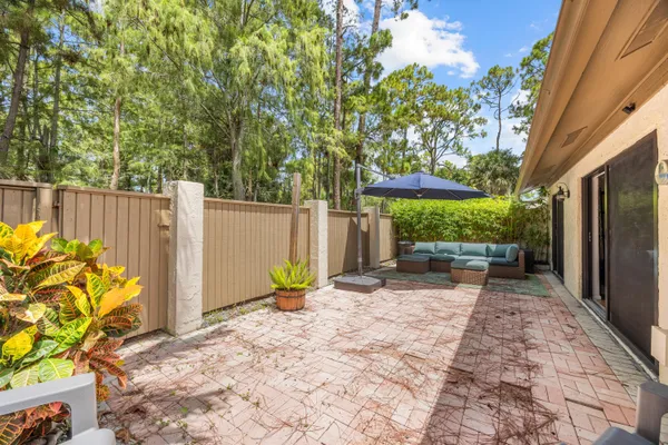 a view of a backyard with a sitting area