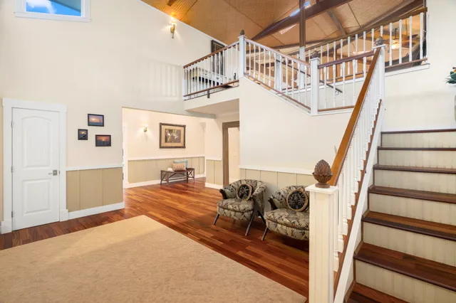 a bedroom with furniture and a chandelier