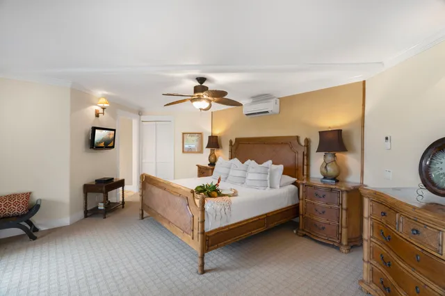 a bedroom with a large bed and a large window