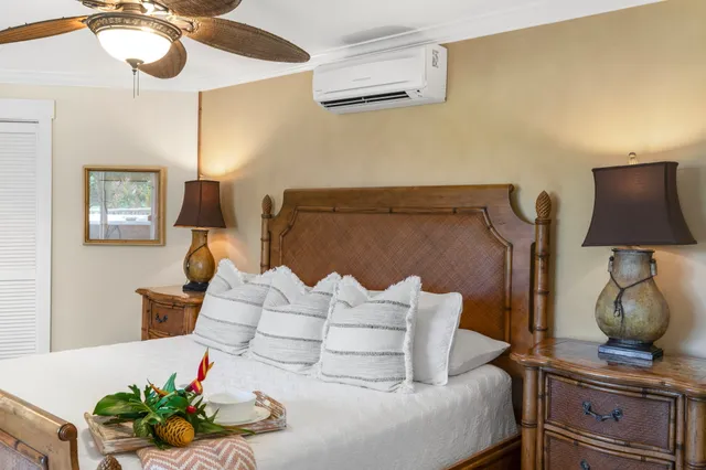 a bathroom with a sink mirror and a bathtub