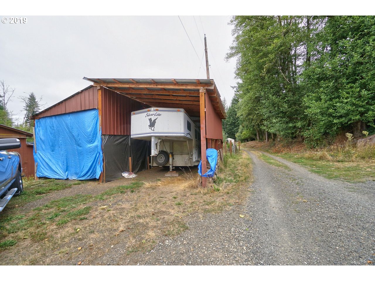 29081 Thistle Hill Road Rainier, OR 97048 - Photo 26 of 32 a view of backyard with wooden fence