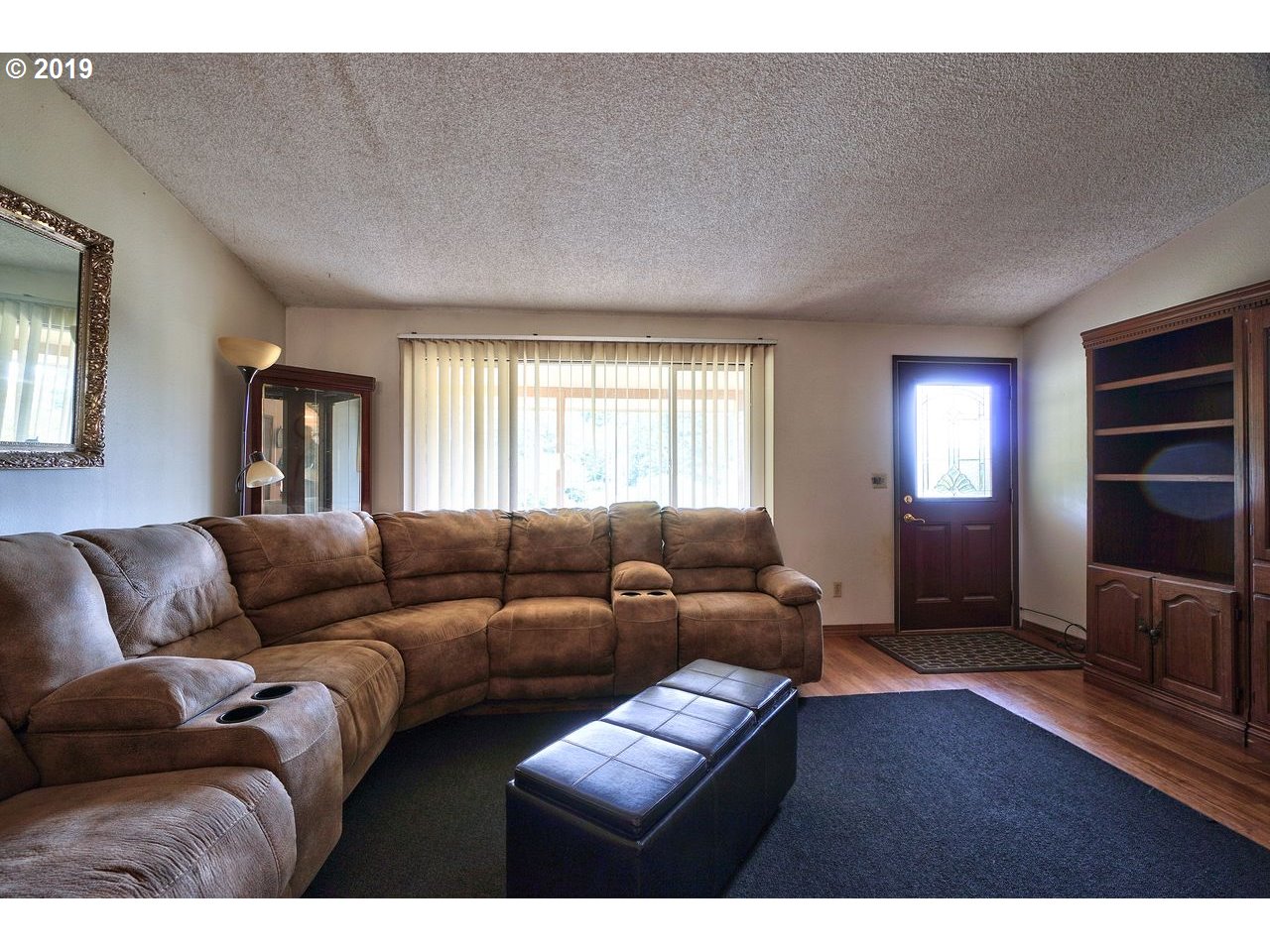 29081 Thistle Hill Road Rainier, OR 97048 - Photo 3 of 32 a living room with furniture and a flat screen tv