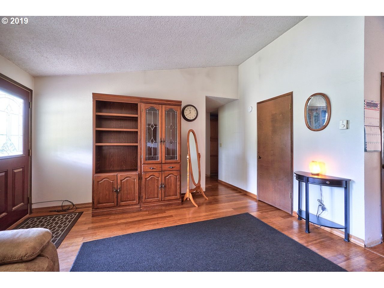 29081 Thistle Hill Road Rainier, OR 97048 - Photo 4 of 32 a view of livingroom with furniture and wooden floor
