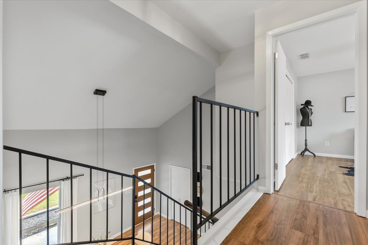 208 Skyloop Drive Austin, TX 78745 - Photo 16 of 34 Open upstairs landing overlooking the dramatic vaulted entry below.