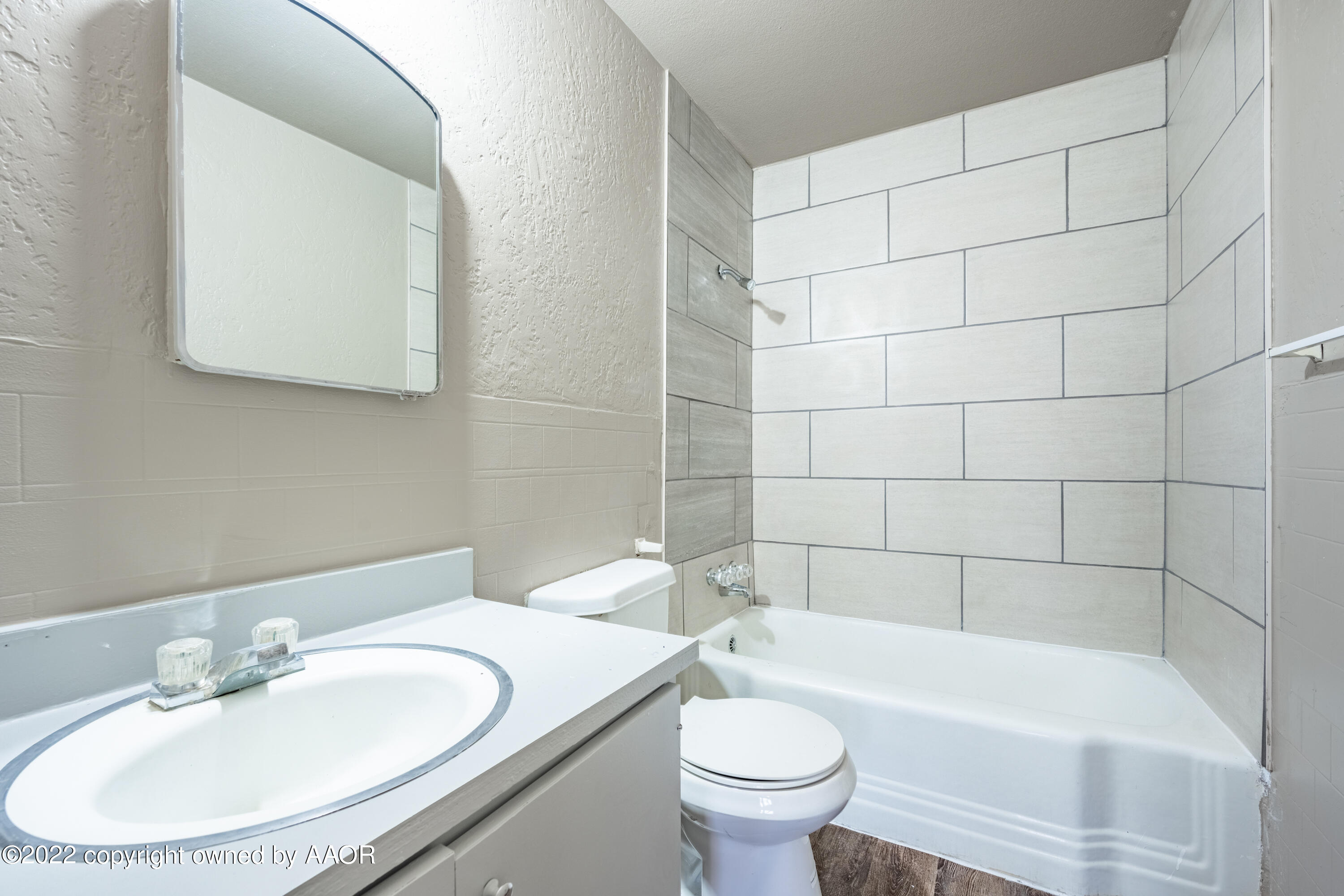 927 South Bryan Street Amarillo, TX 79102 - Photo 9 of 12 a bathroom with a sink and a mirror