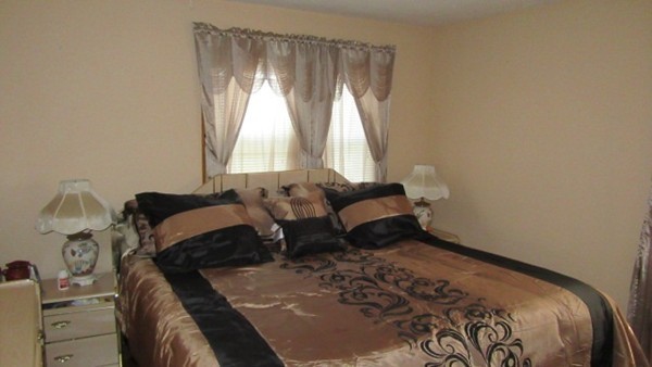 178 Redlands Street Springfield, MA 01104 - Photo 11 of 23 a bedroom with a bed and window