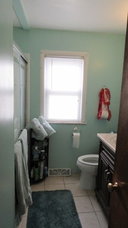 178 Redlands Street Springfield, MA 01104 - Photo 12 of 23 a bathroom with a toilet a sink and a window