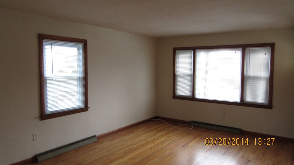 178 Redlands Street Springfield, MA 01104 - Photo 18 of 23 a view of an empty room with wooden floor and a window