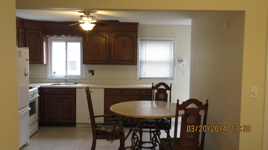 178 Redlands Street Springfield, MA 01104 - Photo 19 of 23 a kitchen with a table chairs a sink and dishwasher
