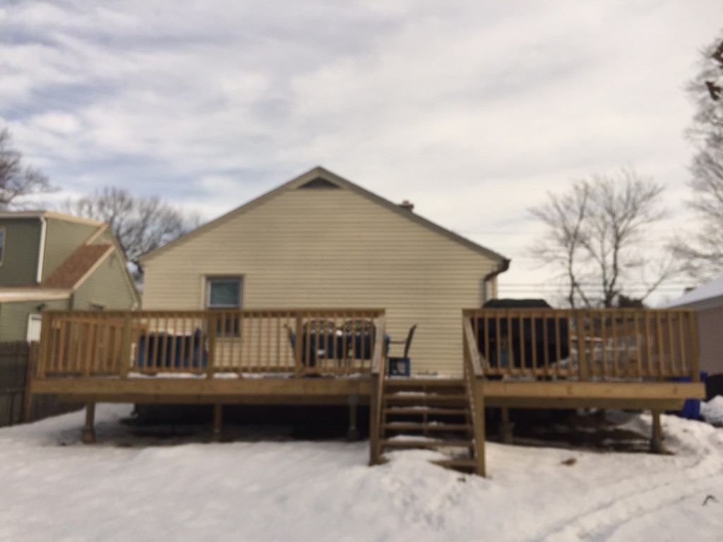 178 Redlands Street Springfield, MA 01104 - Photo 2 of 23 a roof deck with couches and wooden fence