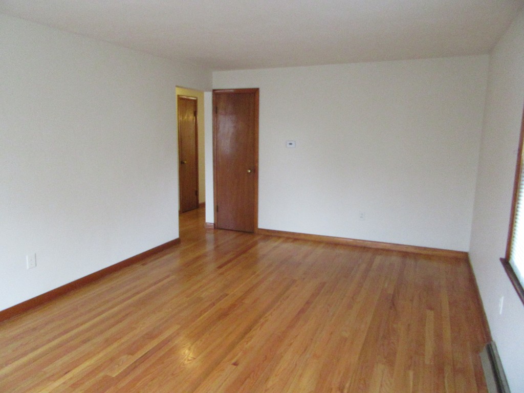 178 Redlands Street Springfield, MA 01104 - Photo 23 of 23 a view of an empty room with wooden floor and closet