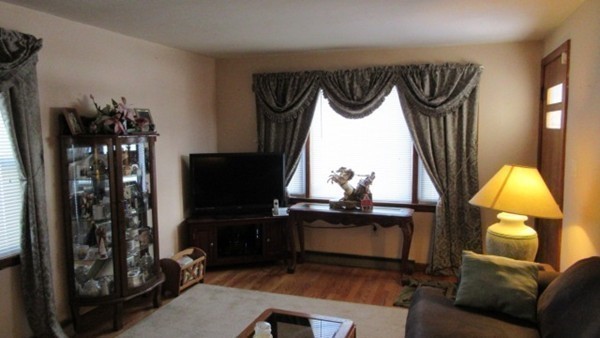 178 Redlands Street Springfield, MA 01104 - Photo 8 of 23 a view of a living room and a couch