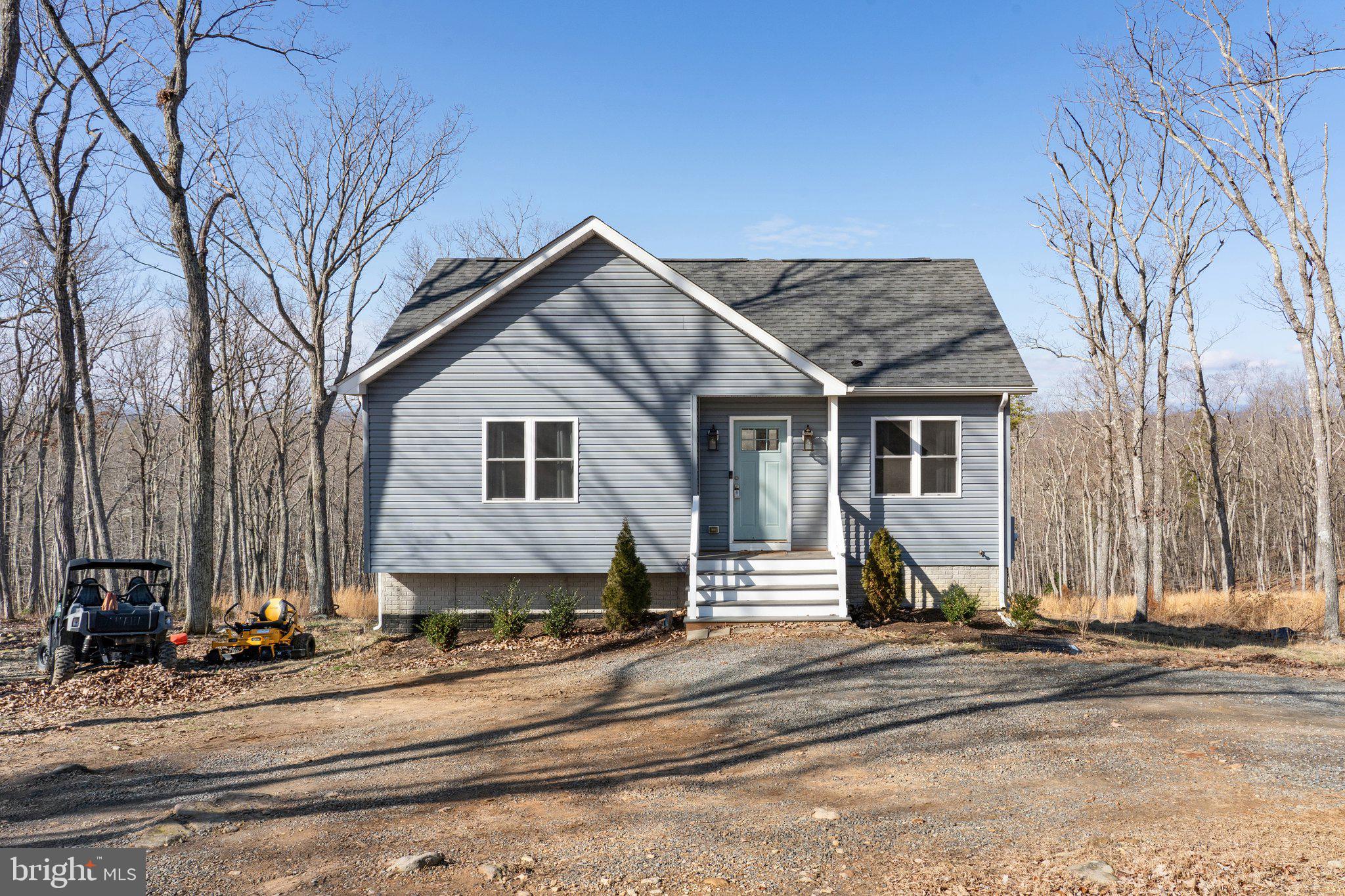 11652 Alum Springs Road Rixeyville, VA 22737 - Photo 1 of 64 a view of a white house with a road next to a road