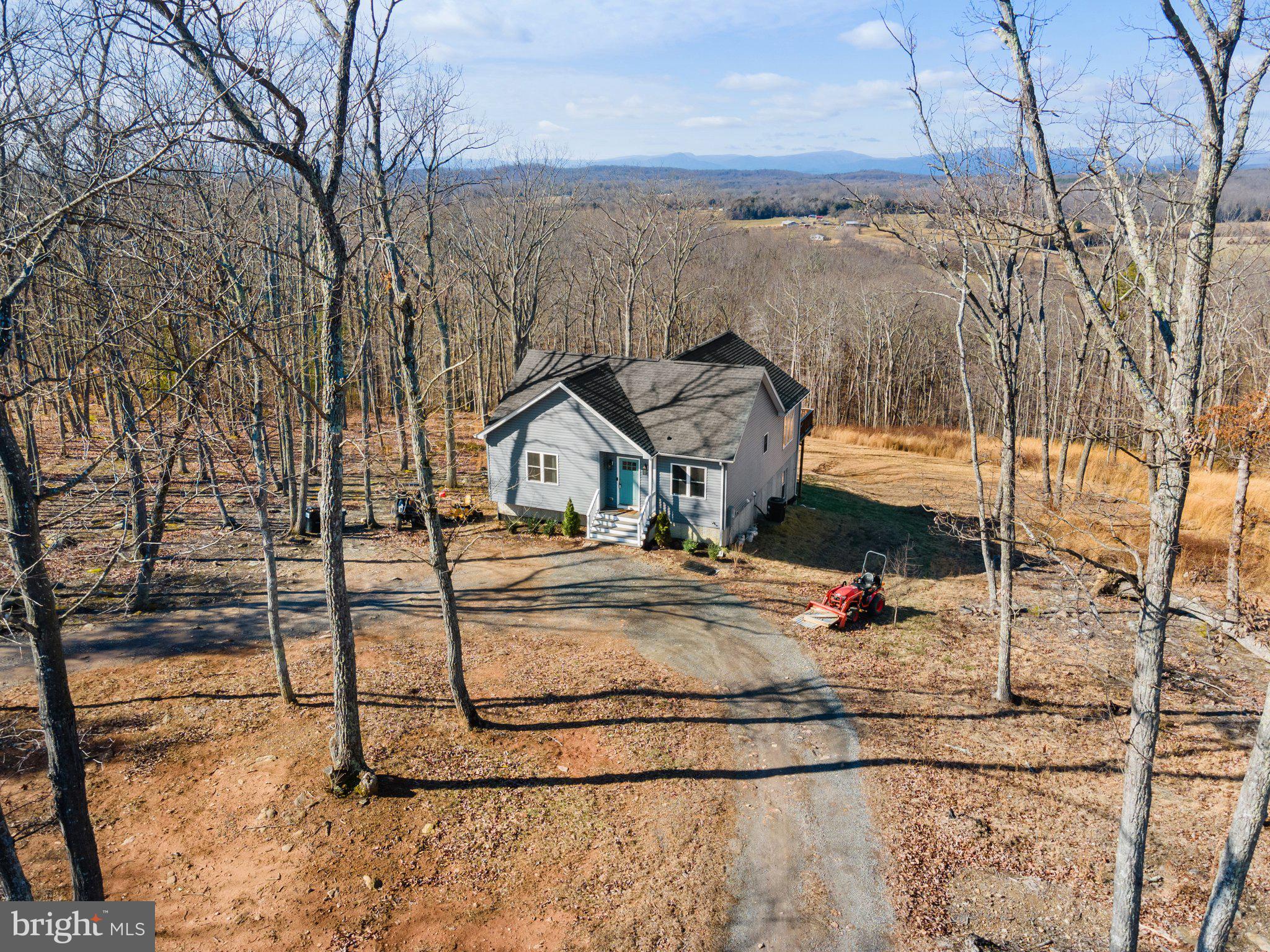 11652 Alum Springs Road Rixeyville, VA 22737 - Photo 15 of 64 a view of a street with an house in the background