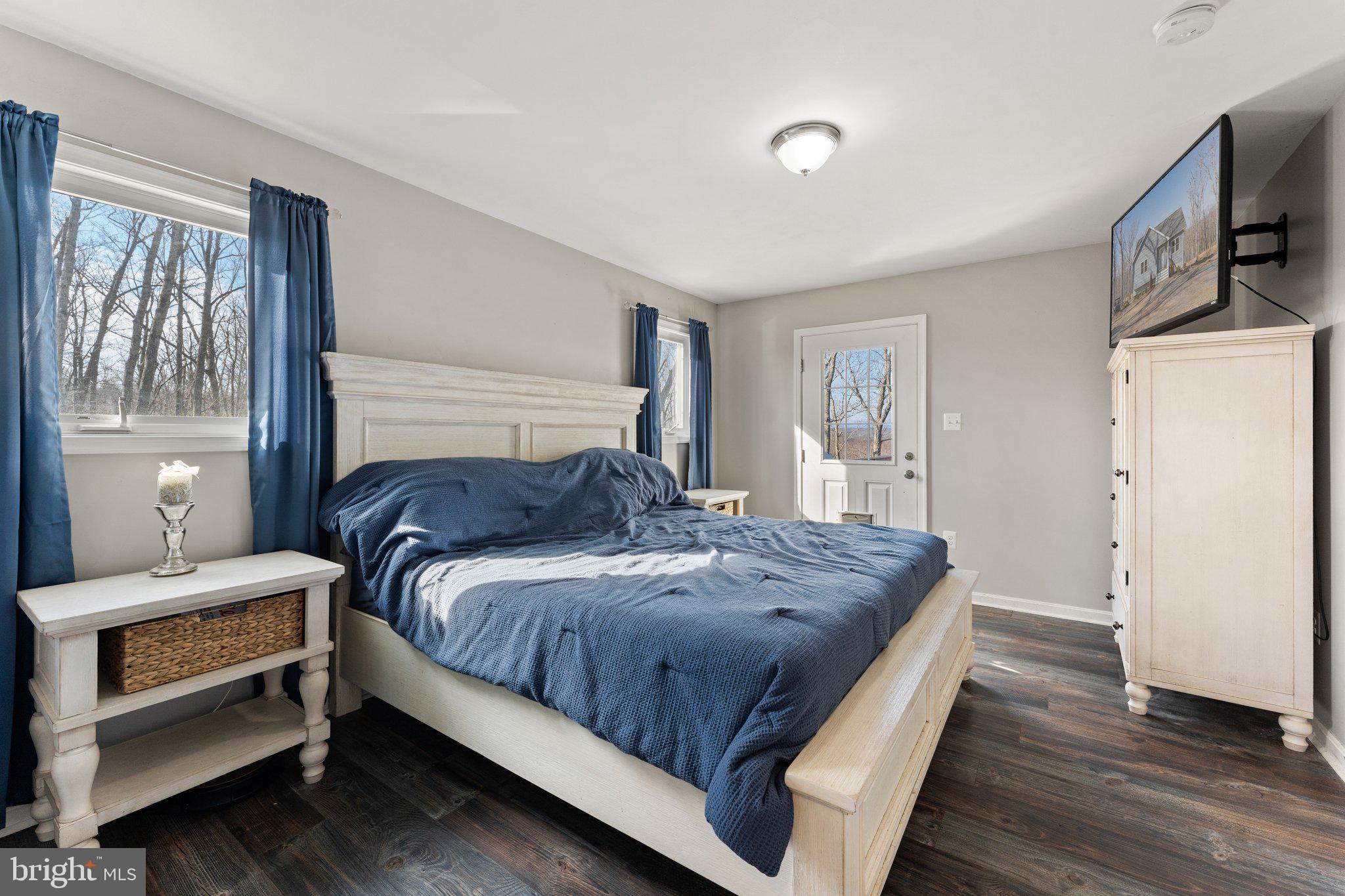 11652 Alum Springs Road Rixeyville, VA 22737 - Photo 35 of 64 a bedroom with a bed and a window