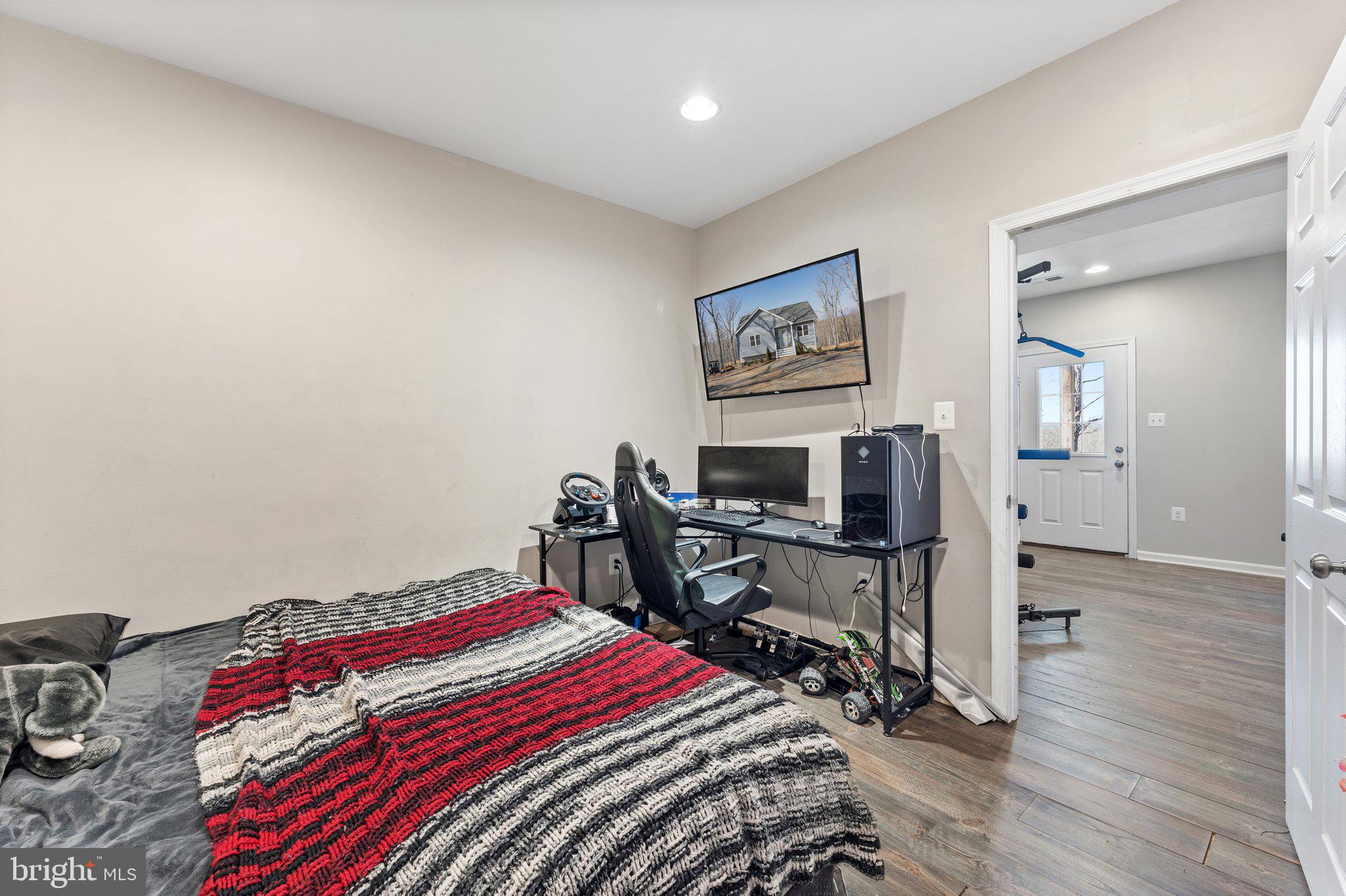 11652 Alum Springs Road Rixeyville, VA 22737 - Photo 44 of 64 a bedroom with bed and a desk