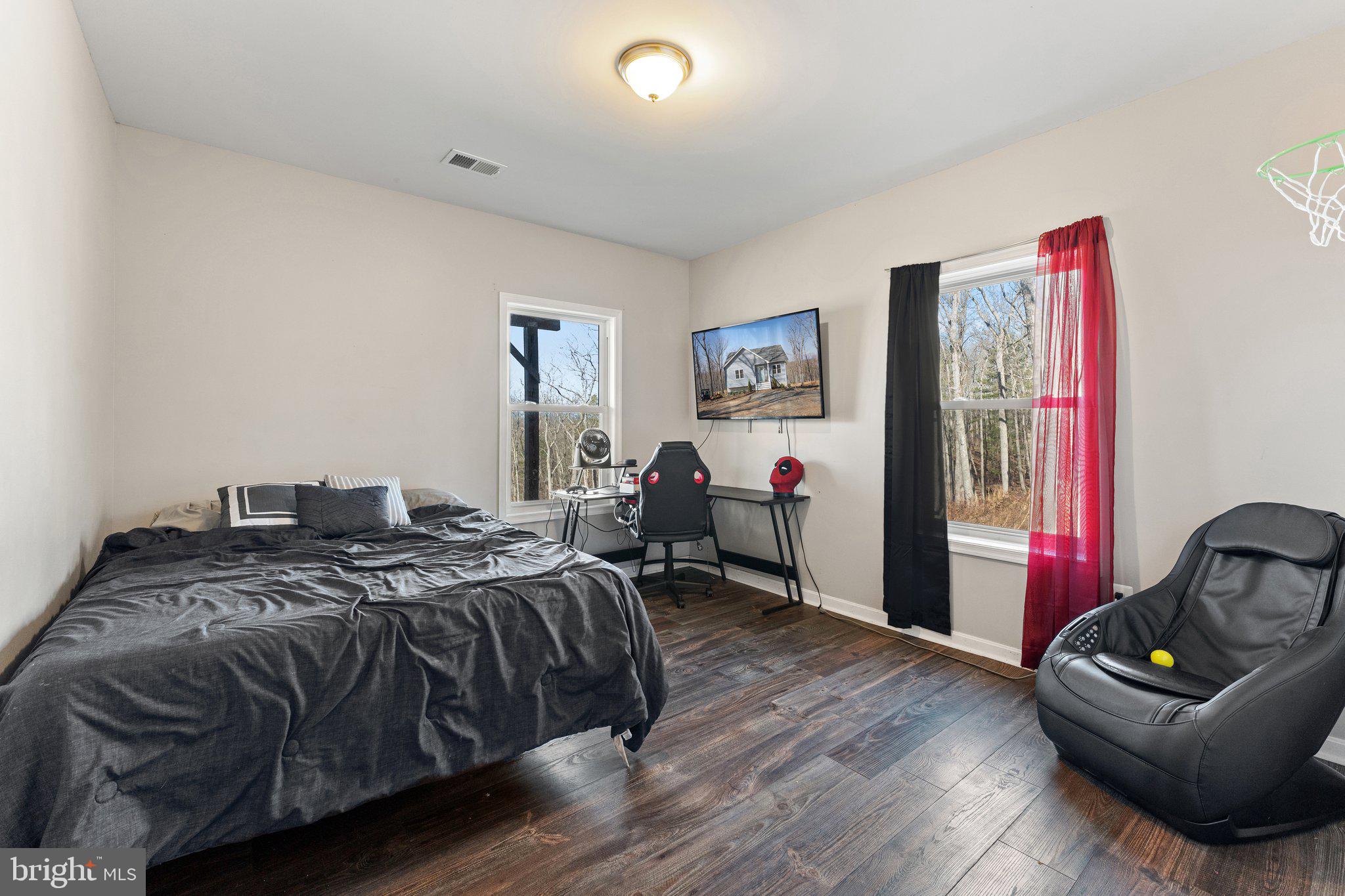 11652 Alum Springs Road Rixeyville, VA 22737 - Photo 48 of 64 a bed room with a bed and a couch