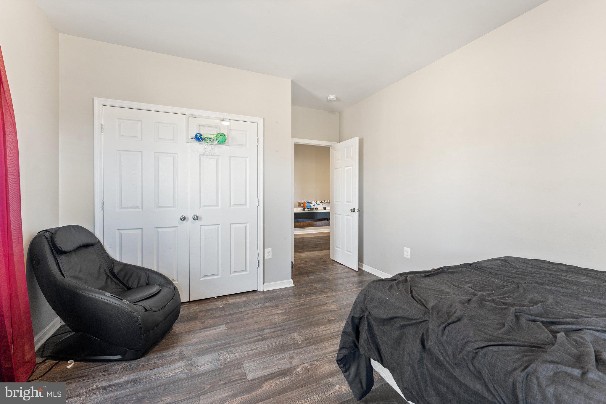 11652 Alum Springs Road Rixeyville, VA 22737 - Photo 49 of 64 a bedroom with a bed and a chair
