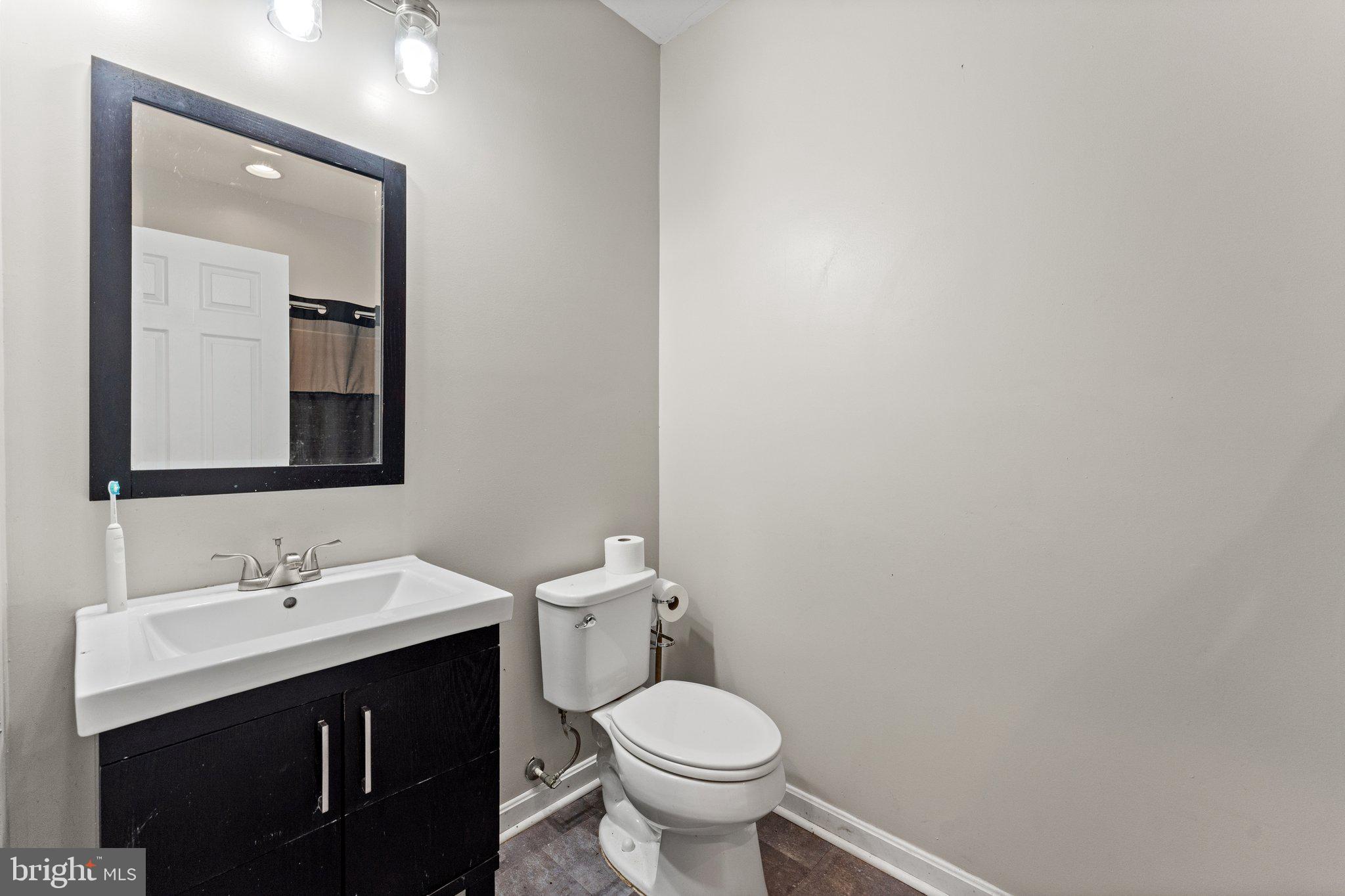 11652 Alum Springs Road Rixeyville, VA 22737 - Photo 50 of 64 a bathroom with a sink and a toilet