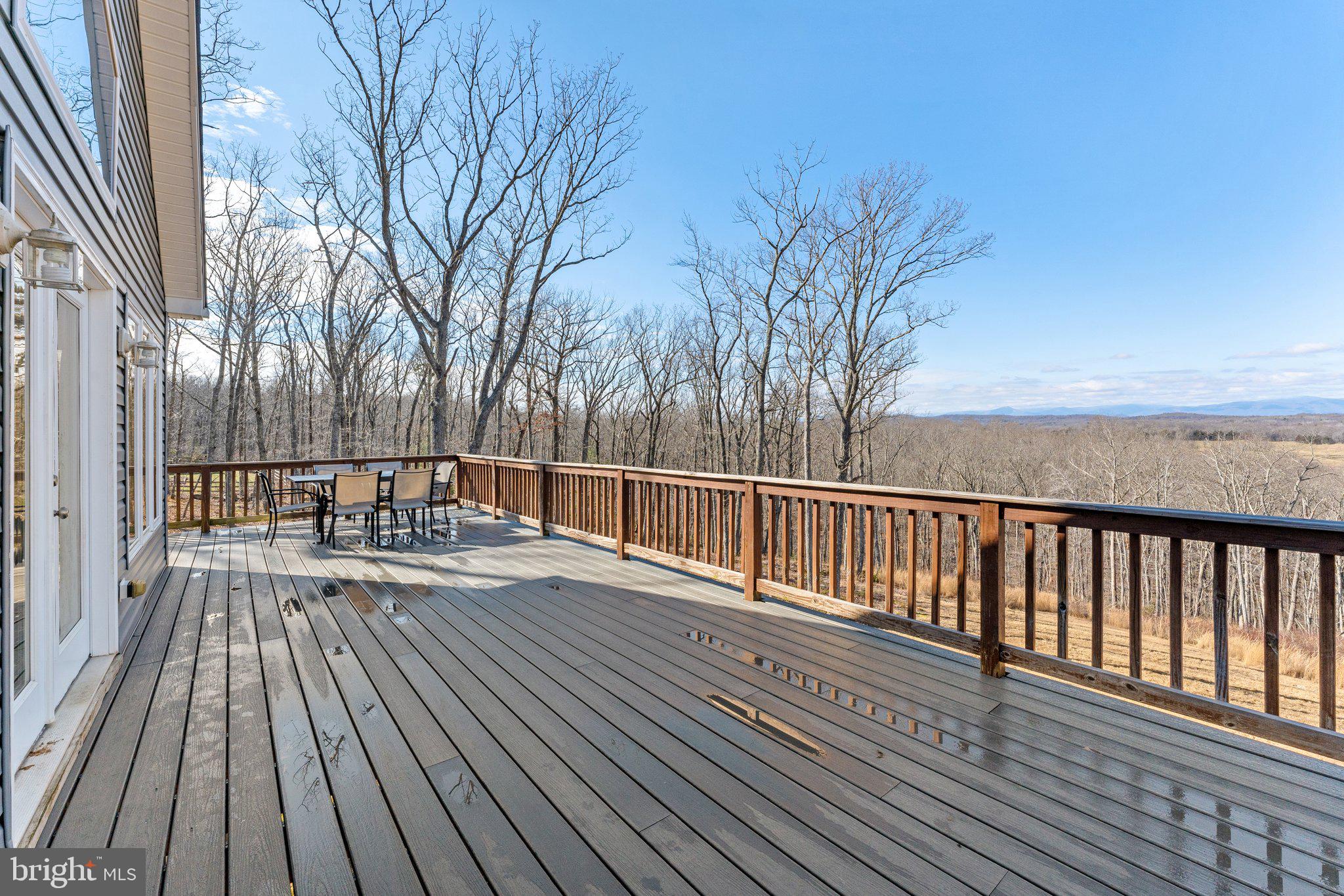 11652 Alum Springs Road Rixeyville, VA 22737 - Photo 52 of 64 a view of balcony with wooden floor and fence