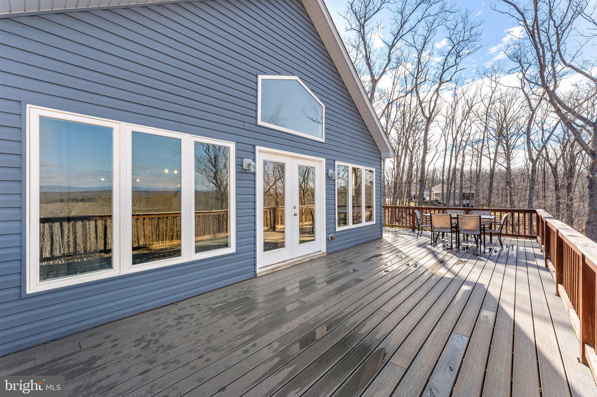11652 Alum Springs Road Rixeyville, VA 22737 - Photo 53 of 64 a view of a house with wooden deck