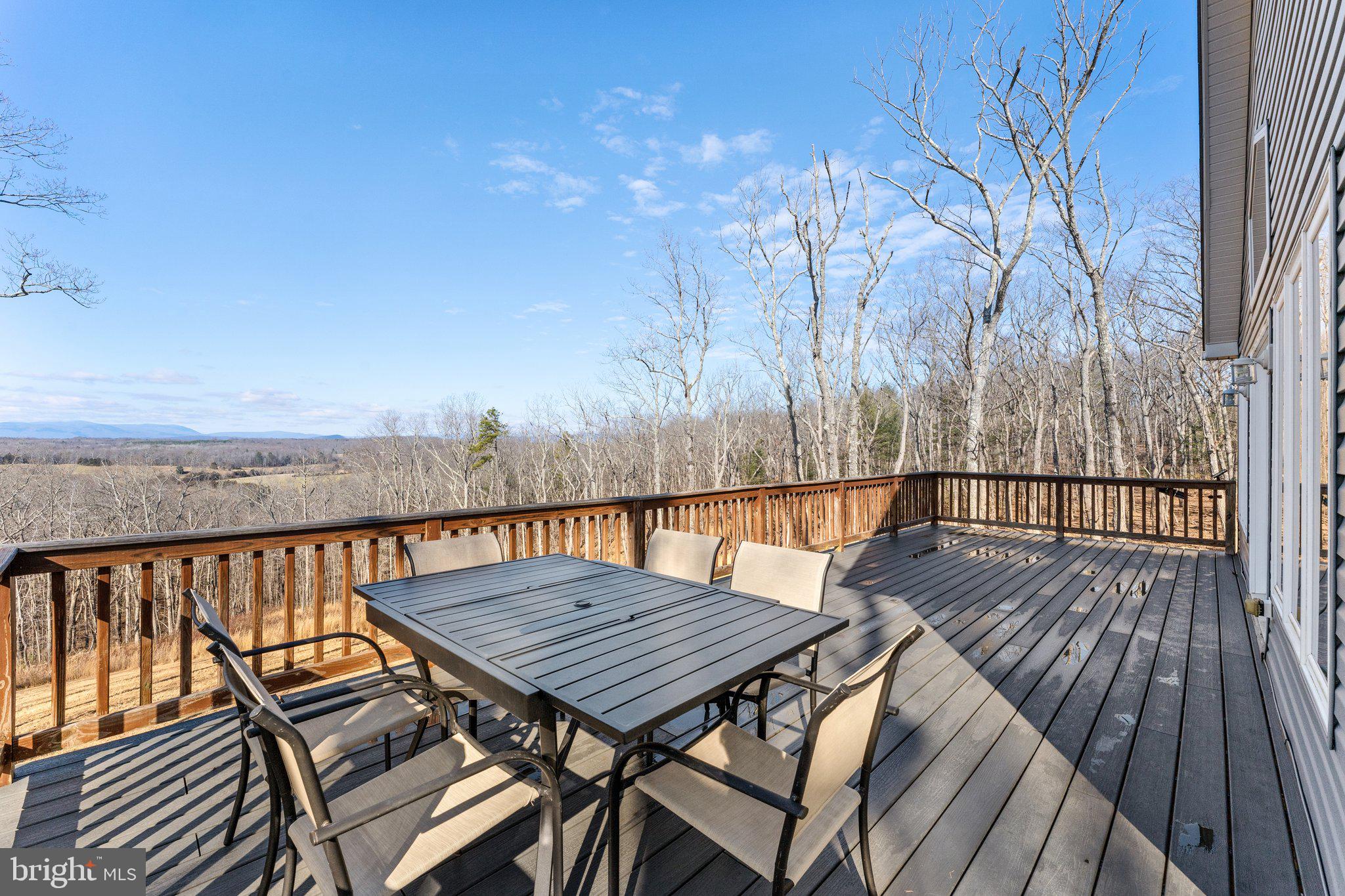11652 Alum Springs Road Rixeyville, VA 22737 - Photo 54 of 64 a view of balcony with wooden floor and seating space
