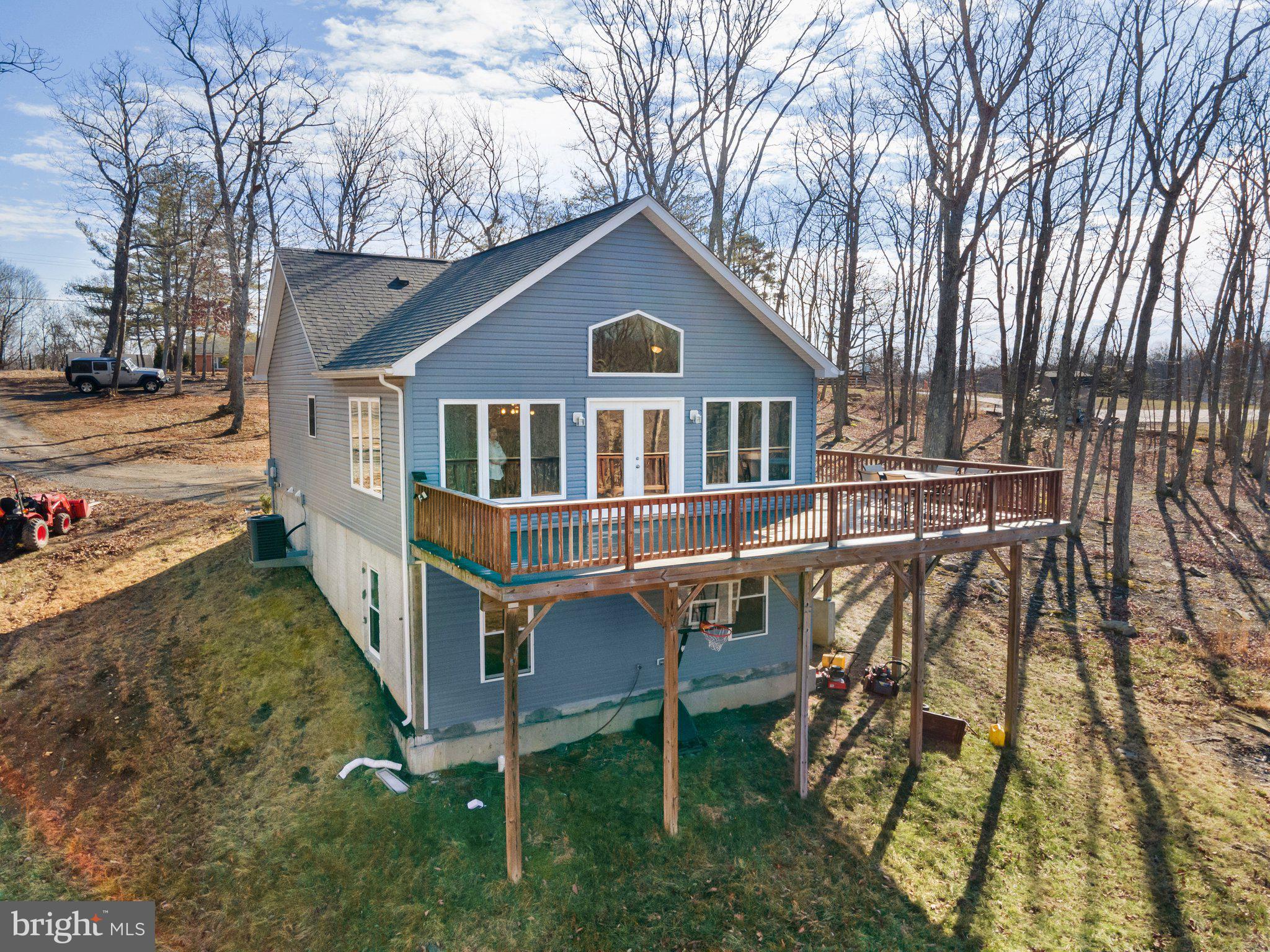11652 Alum Springs Road Rixeyville, VA 22737 - Photo 60 of 64 a house with trees in the background