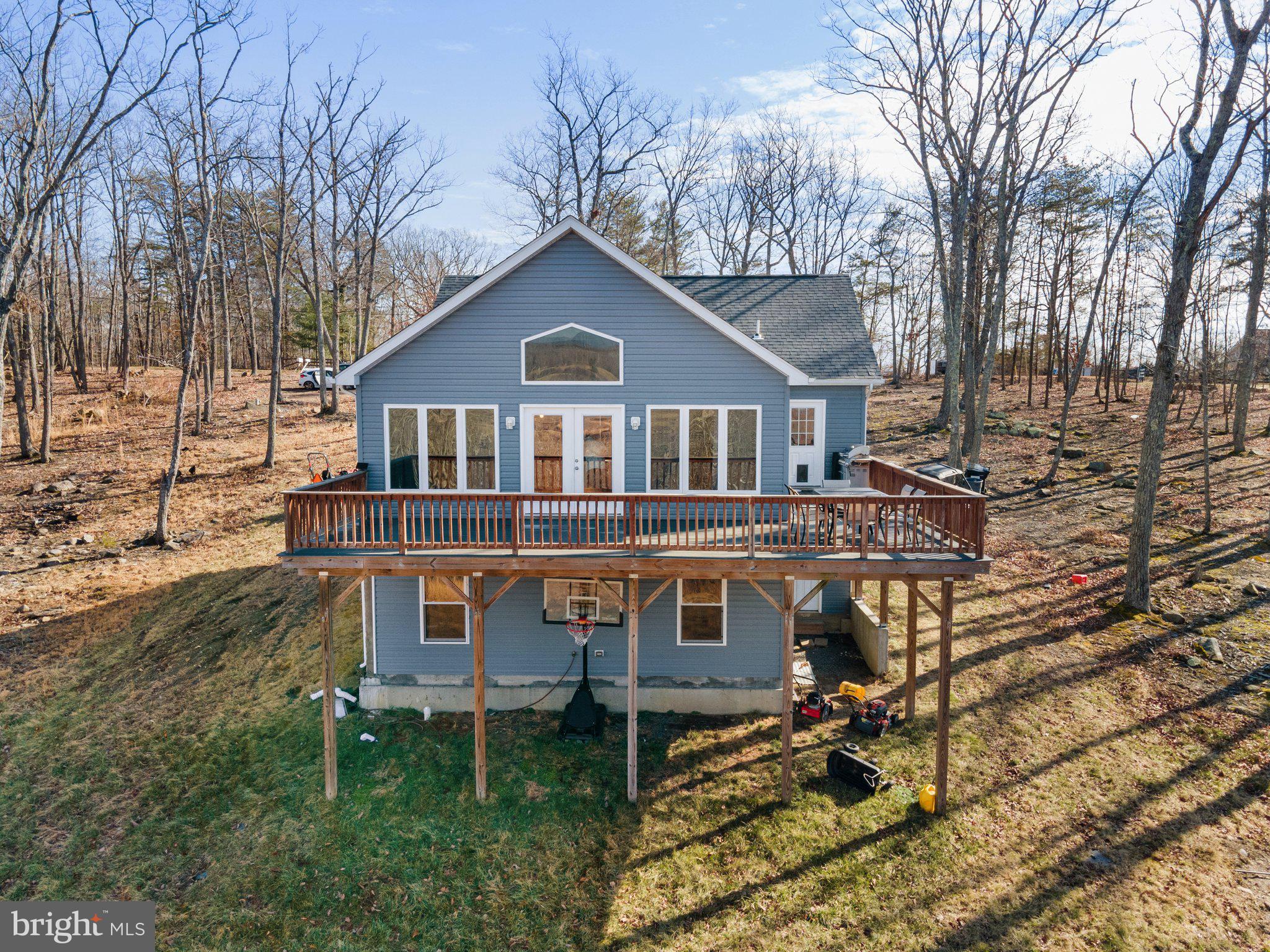 11652 Alum Springs Road Rixeyville, VA 22737 - Photo 61 of 64 a front view of a house with a yard and trees