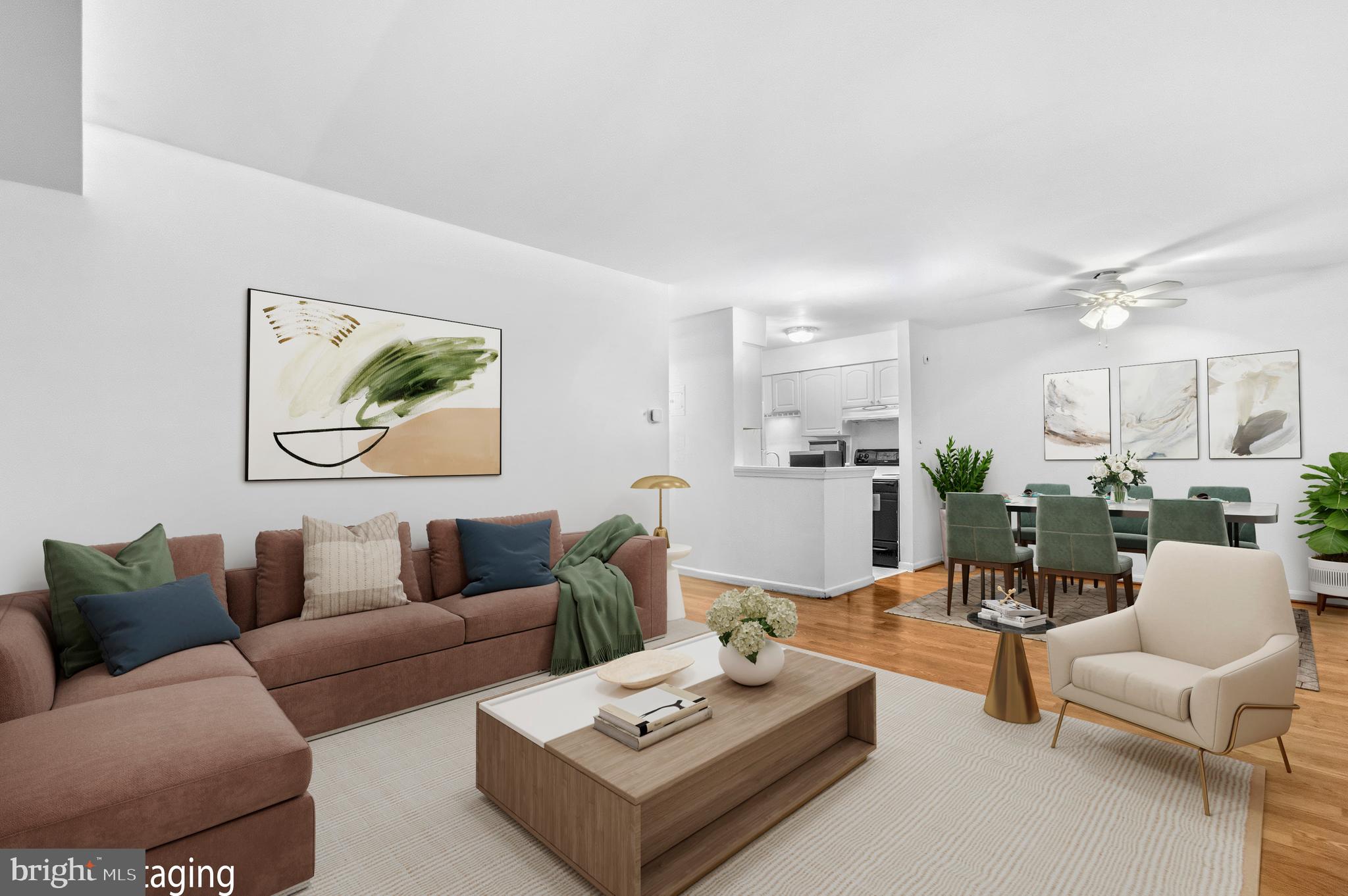 5913 Prince James Drive, Unit J Springfield, VA 22152 - Photo 1 of 33 a living room with furniture and wooden floor