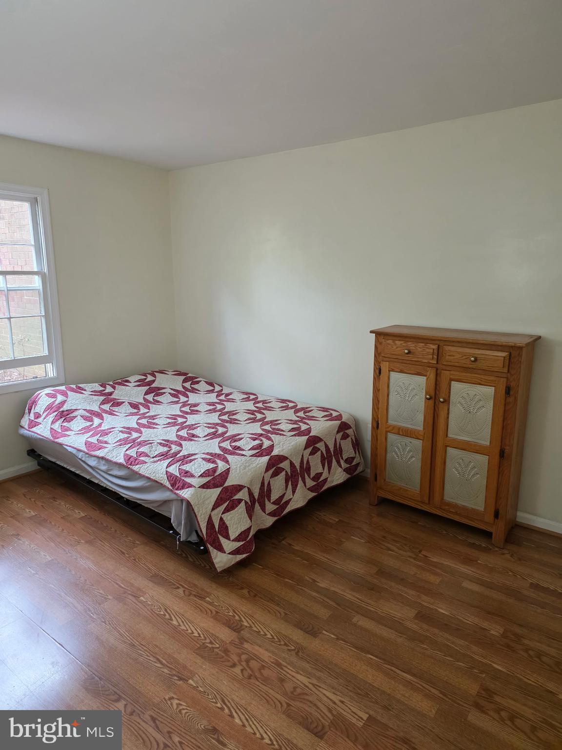 5913 Prince James Drive, Unit J Springfield, VA 22152 - Photo 12 of 33 a bedroom with a bed and wooden floor