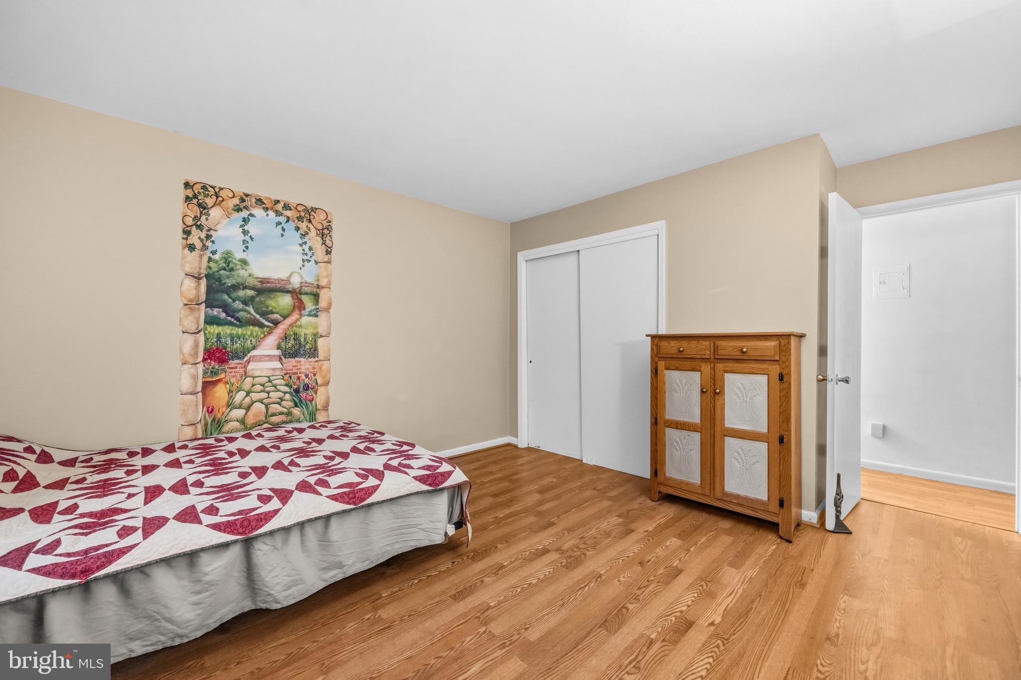 5913 Prince James Drive, Unit J Springfield, VA 22152 - Photo 13 of 33 a bedroom with a bed and painting on the wall