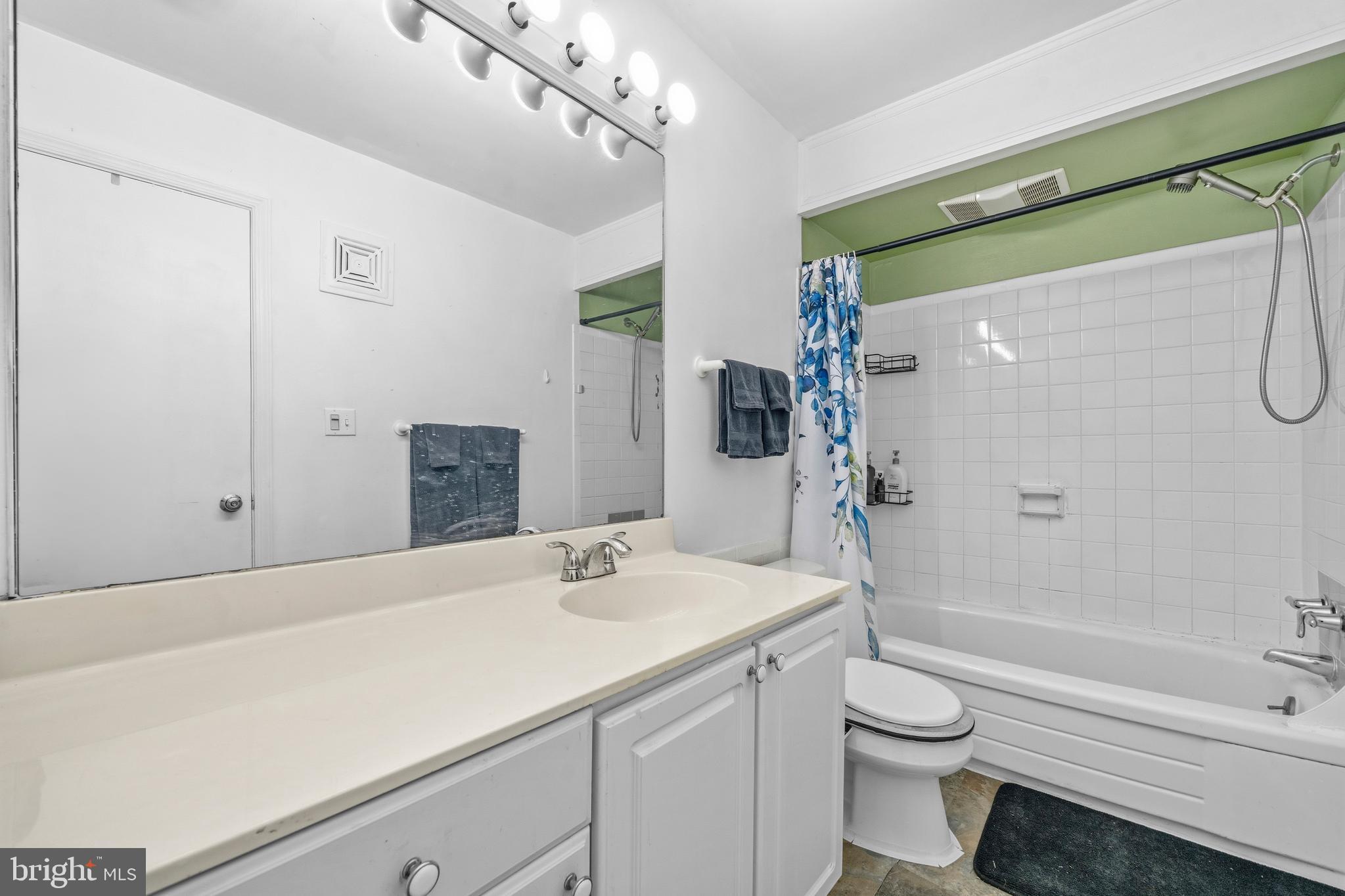 5913 Prince James Drive, Unit J Springfield, VA 22152 - Photo 18 of 33 a bathroom with a sink a toilet and shower