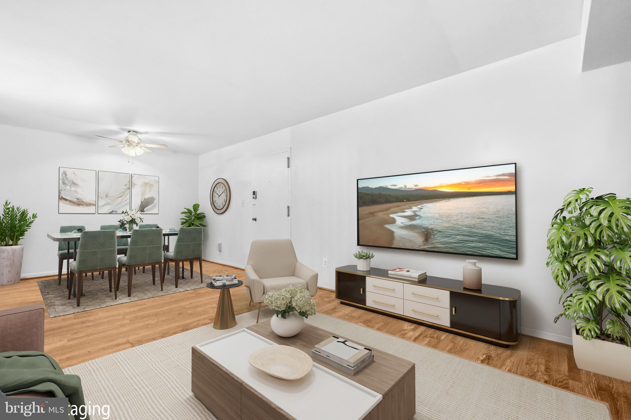 5913 Prince James Drive, Unit J Springfield, VA 22152 - Photo 3 of 33 a living room with furniture and a flat screen tv