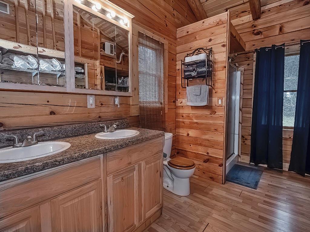 43 Klages Road West Alexander, PA 15376 - Photo 18 of 23 a bathroom with a granite countertop toilet a sink and a mirror