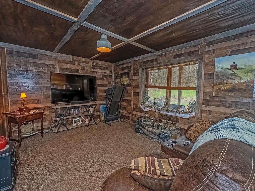 43 Klages Road West Alexander, PA 15376 - Photo 20 of 23 a living room with furniture a flat screen tv and a fireplace