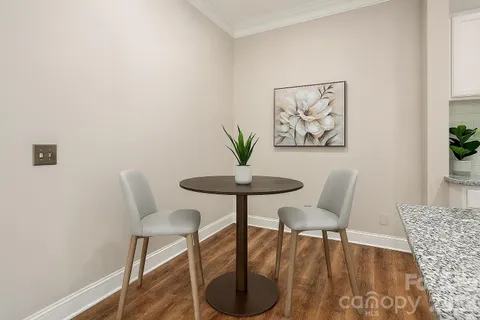 a view of a livingroom with a table and chair