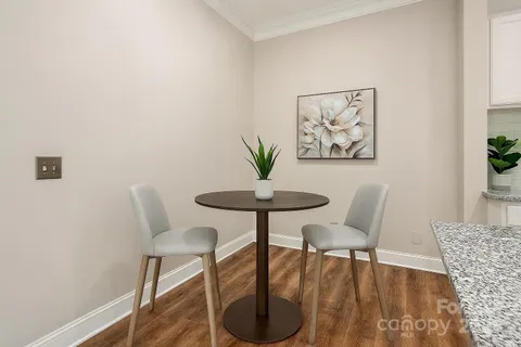 a view of a livingroom with a table and chair