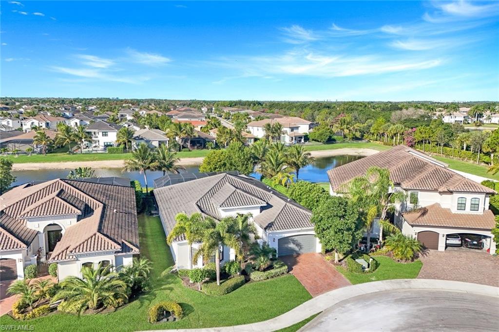 4549 Azalea Drive Naples, FL 34119 - Photo 3 of 49 an aerial view of residential houses with outdoor space and trees